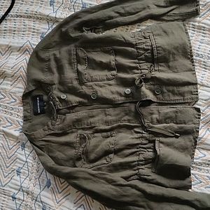 Lightweight green jacket with hidden buttons